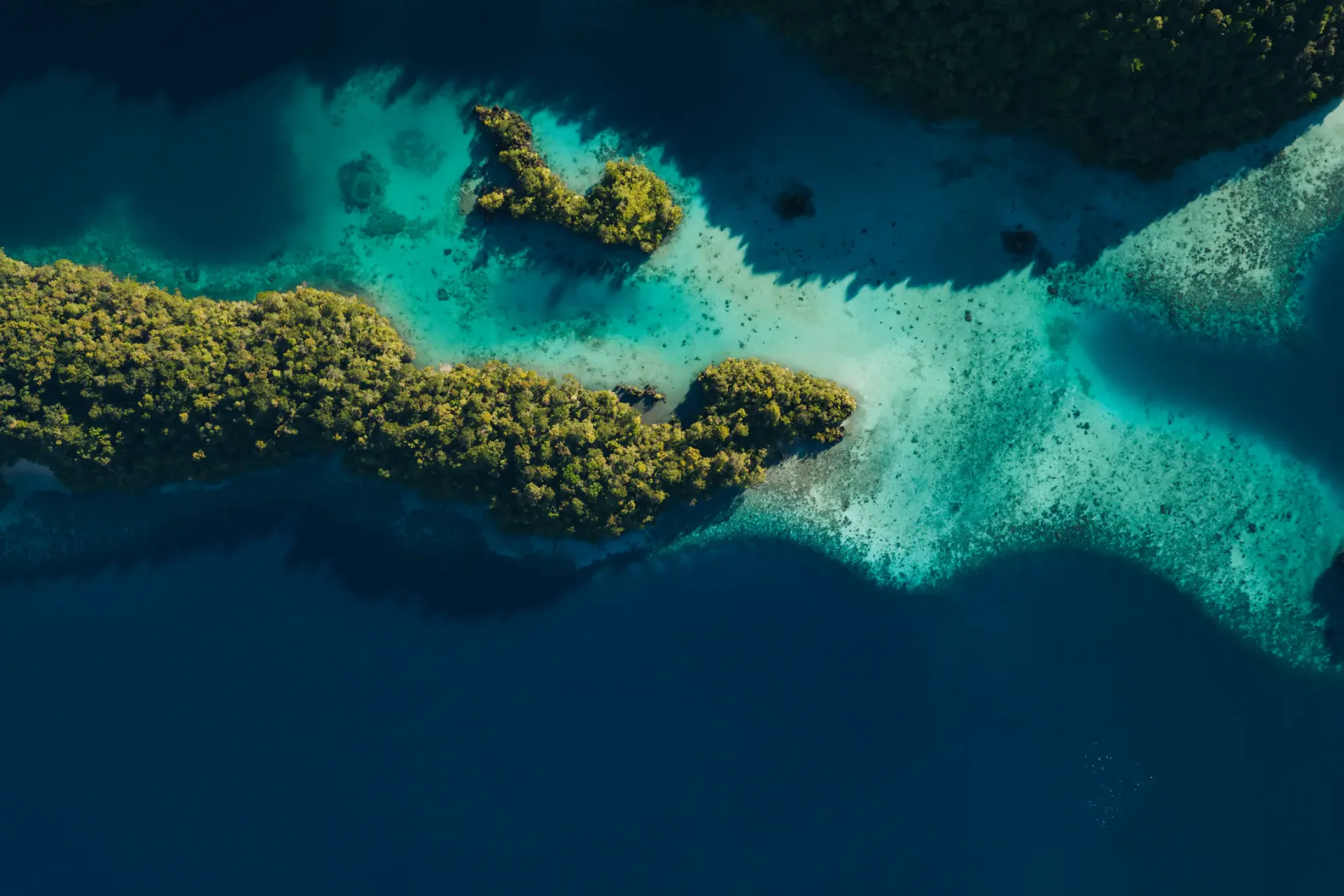 Aerial view of reef in Indonesia during optimal yacht charter season